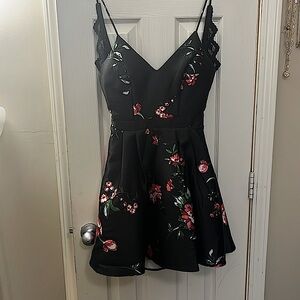 A cute twist on a little black dress, with a lacey upper back.